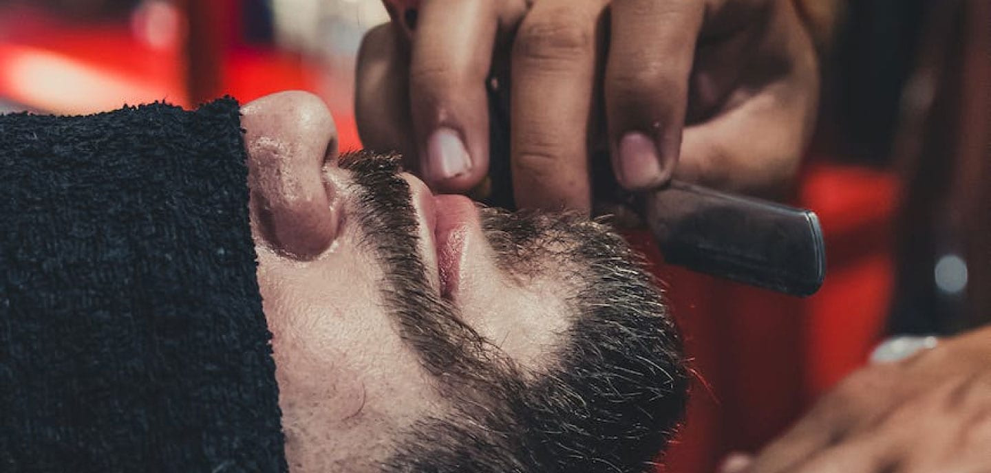 Straight razor shave in progress